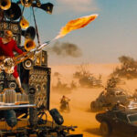 Mad Max's Flame-Throwing Guitarist Channeled Soundgarden & Sepultura While Filming
