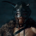 Amon Amarth Go Behind The Scenes Of 'Keyboard Warrior' Clip