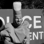 Rage Against The Machine's Tim Commerford Becomes A Walking Middle Finger In New Wakrat Video