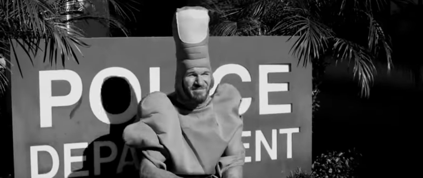 Rage Against The Machine's Tim Commerford Becomes A Walking Middle Finger In New Wakrat Video