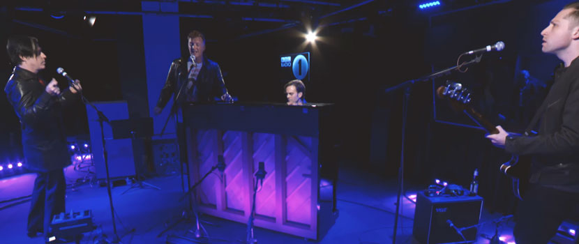 Watch Queens Of The Stone Age Perform A Piano Driven Cover & More For BBC Radio 1