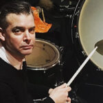 Watch Drummer John Stainer Return To His Helmet Days With Live "Milquetoast" Cover