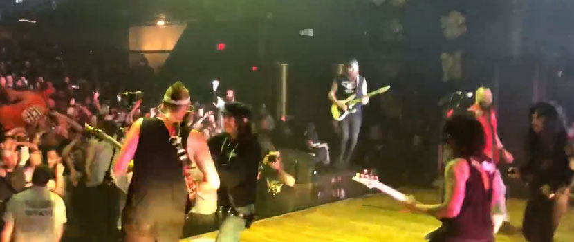 Watch Killswitch Engage's Adam Dutkiewicz Be Fed Pizza Mid-Guitar Solo At Worcester, MA Show