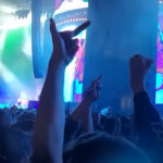 Machine Gun Kelly Booed Throughout 'Louder Than Life' Set, Throws Punch At Hostile Audience Member