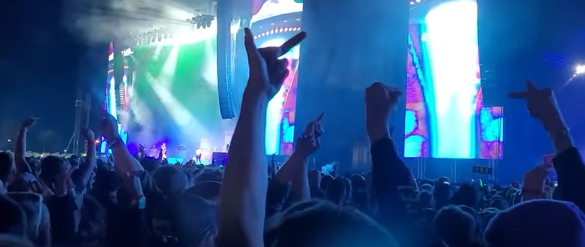 Machine Gun Kelly Booed Throughout 'Louder Than Life' Set, Throws Punch At Hostile Audience Member