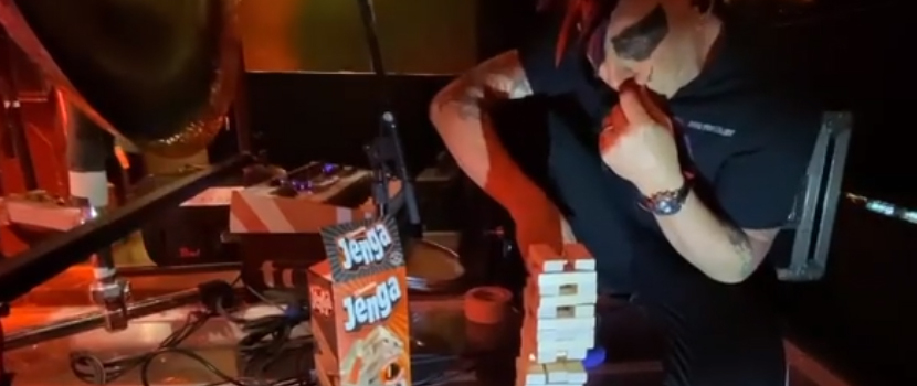 Watch Tool's Maynard James Keenan Attempt To Play Jenga Behind Danny Carey's Drum Kit During A Live Show