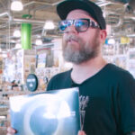Watch In Flames' Anders Fridén Show Off His Amoeba Music Haul For 'What's In My Bag?'