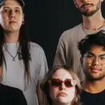 Watch Ayla Tesler-Mabé Cover Primus' "Jerry Was A Race Car Driver" In A Single Studio Session