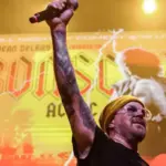 Dean Delray Lines Up Alice In Chains, Rage Against The Machine, Queens Of The Stone Age, Etc. Members For His Final Bon Scott Tribute Show