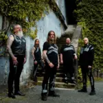 Enslaved Team With Blackfeet Nation Elder Kevin Kicking Woman On New Track "Spirit Helper"